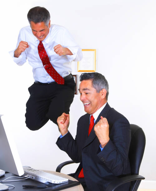 istock Excited business colleagues in office 170619276