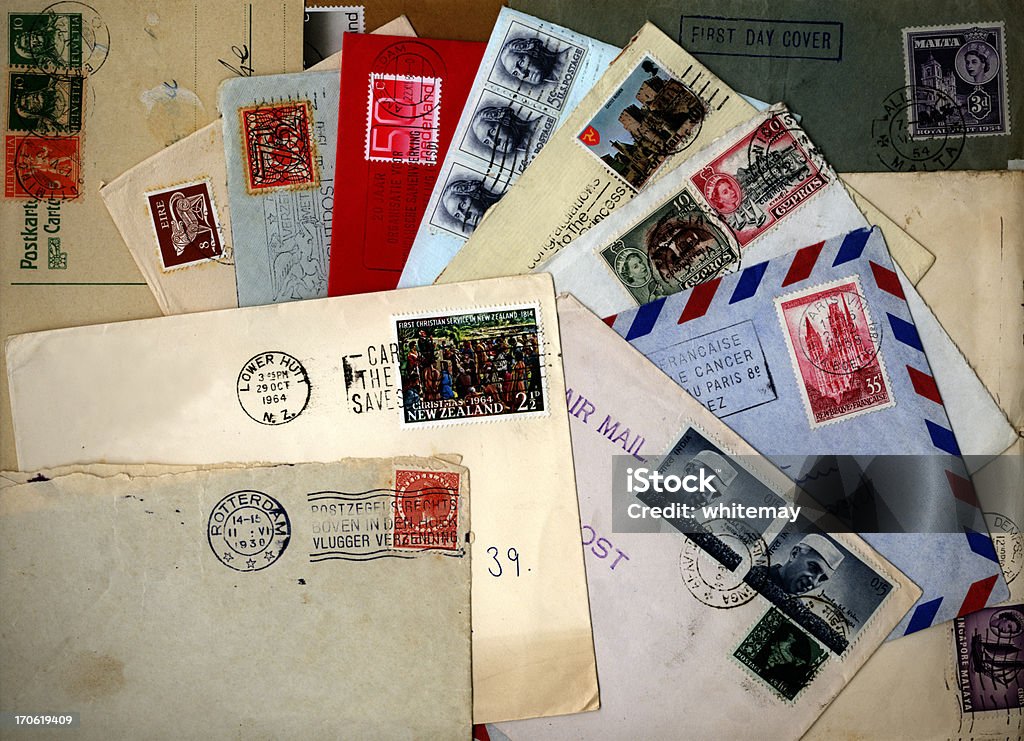 Collection of international envelopes A pile of letters from diverse places. Postage Stamp Stock Photo