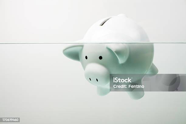 White Piggy Bank Sinking In Water Stock Photo - Download Image Now - Bankruptcy, Finance, Debt