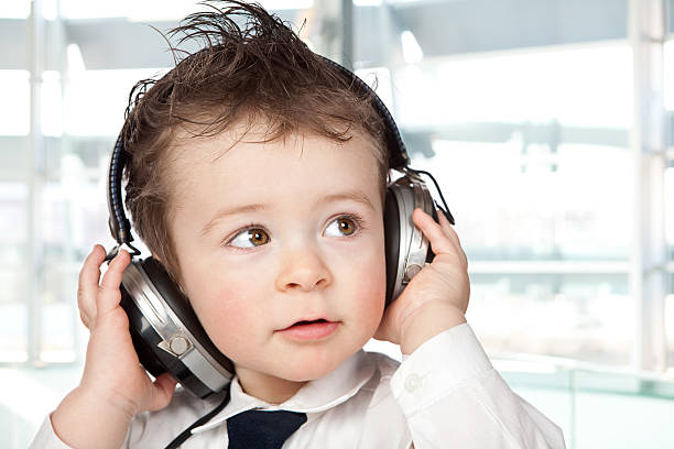 istock beautiful kid portrait with headset at office 170619505