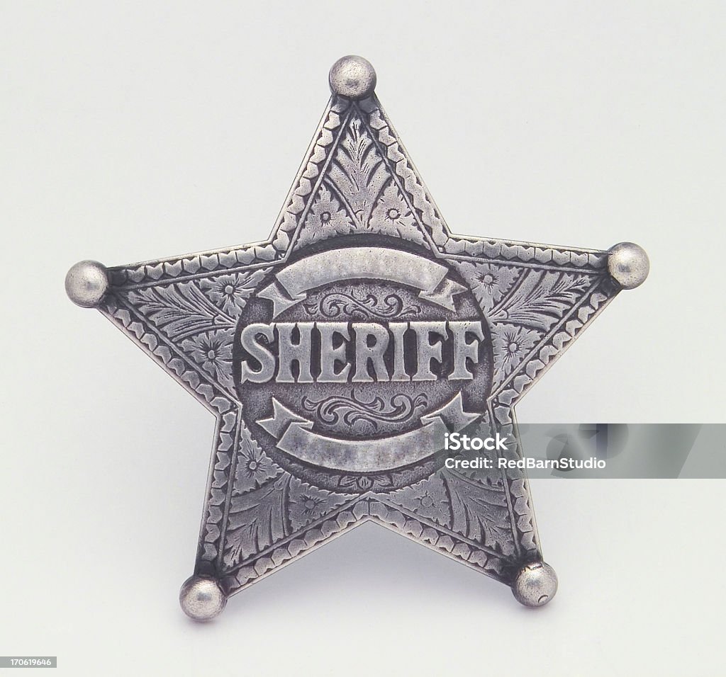 Star Shaped Sheriffs Badge, Badge, Star, Pin, Law A silver star shaped sheriffs badge Isolated on a white background. Has area's to add additional text such as a name or a badge number. This would be good for any project involving law enforcement, old western designs, or cowboys. If you don't see similar images below please visit my profile. Police Badge Stock Photo