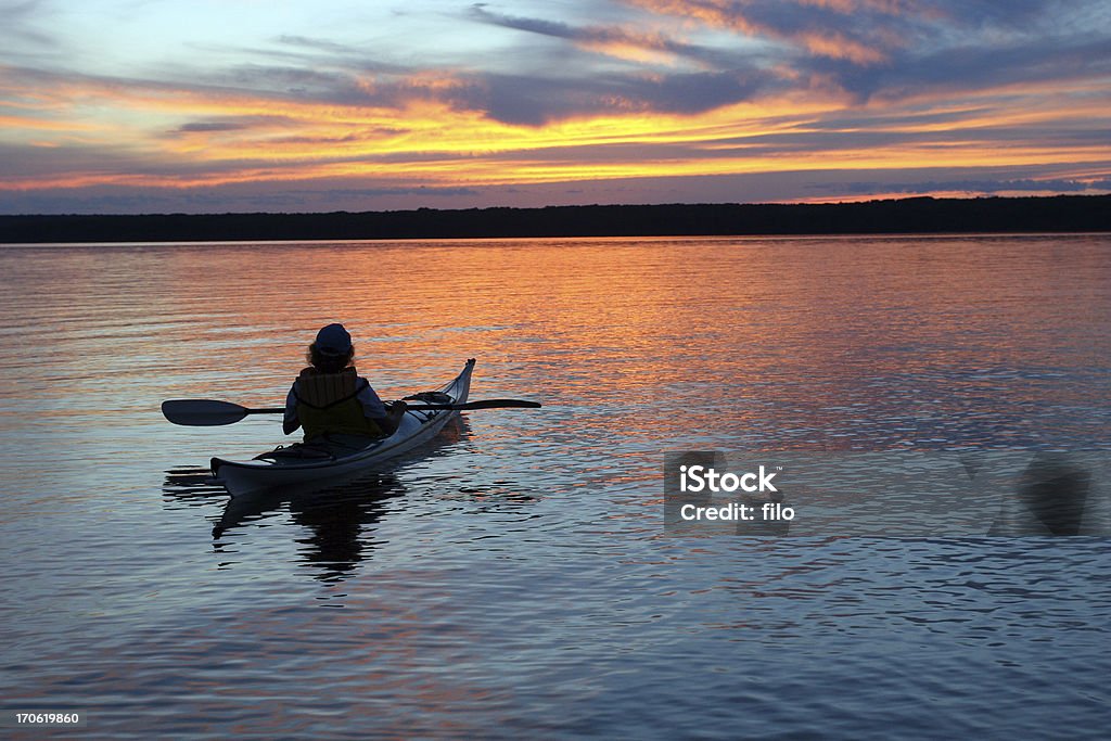 Sunset Kayaker A serene sunset on Lake Superior. Activity Stock Photo