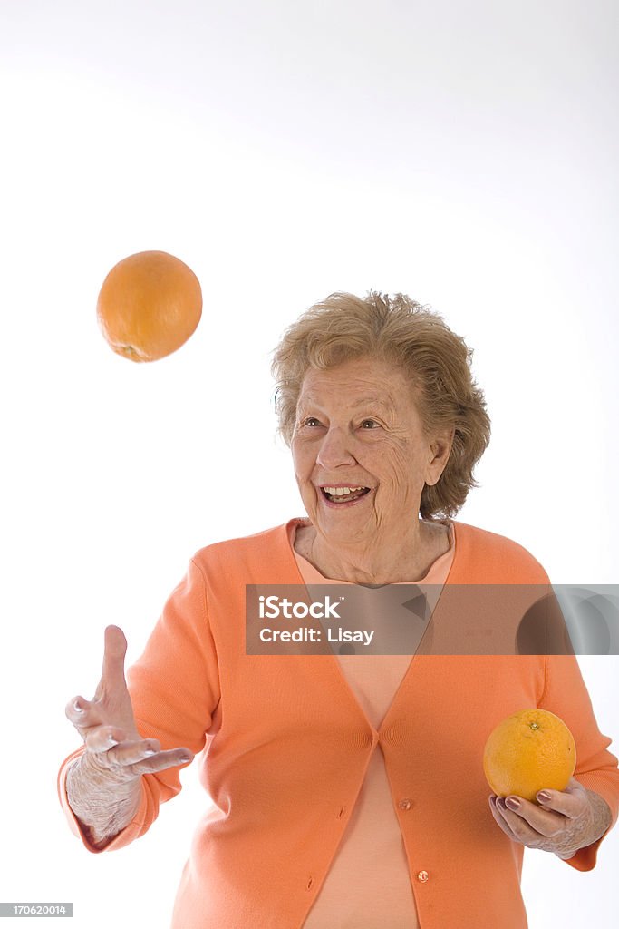 Mulher Atirando laranjas - Royalty-free Adulto Foto de stock