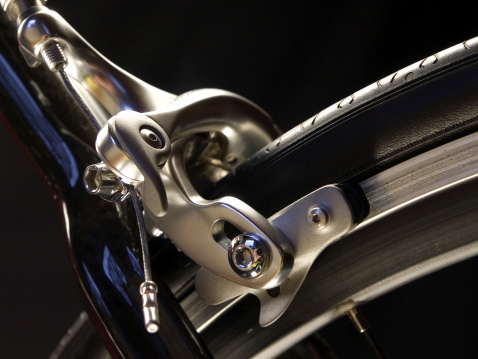Close-up of a racing cycle in the studio light.