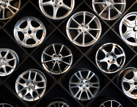 Consumer choice. A wall of alloy wheels at a specialist accessory-dealer's store. Camera: Canon 5D.