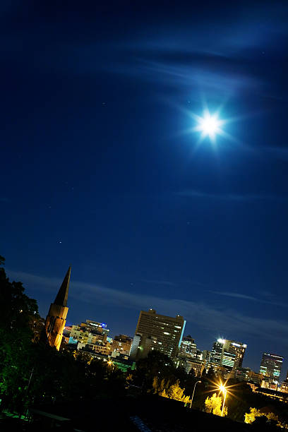 Moon, church, city lights
