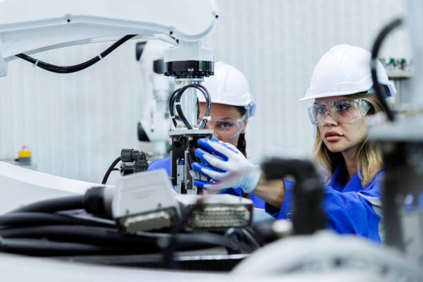 istock female automation machine engineer student study and inspection control robot arm machine in university or factory workshop. ai robot technology new innovation trend of manufacturing in industry 5.0 1706208347