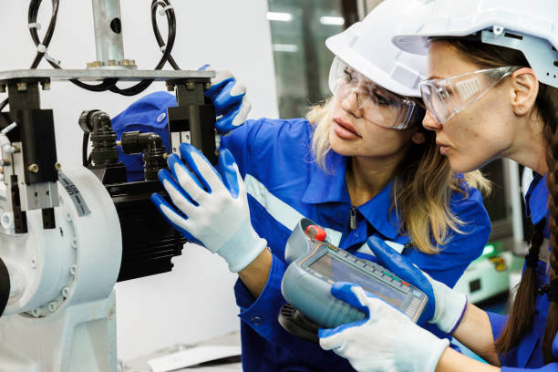 istock female automation machine engineer student study and inspection control robot arm machine in university or factory workshop. ai robot technology new innovation trend of manufacturing in industry 5.0 1706208379