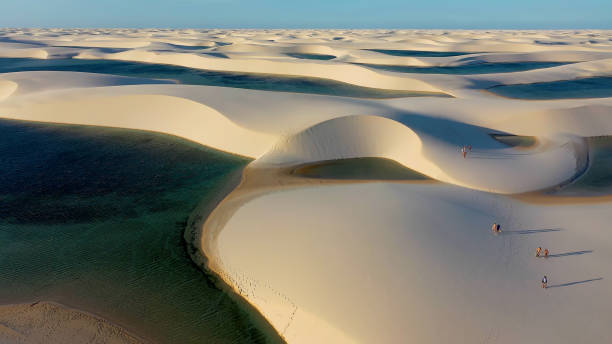 Sand dunes and rain water lagoons at northeast brazilian paradise Sand dunes and rain water lagoons at northeast brazilian paradise. World travel destinations. Tropical scenery. Lencois Maranhenses Maranhao Brazil. brazil desert maranhao state national park stock pictures, royalty-free photos & images