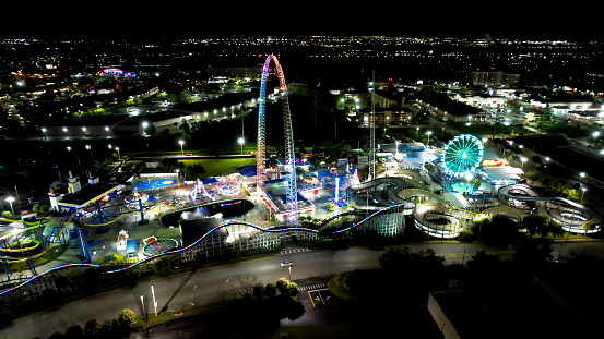 Night cityscape Orlando Florida United States. Night aerial landscape of stunning amusement park and people funny. Night scape Orlando Florida. Night city Orlando United States.
