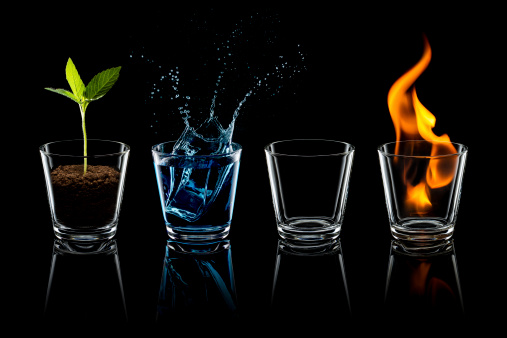 Photography of the four elements in water glasses.