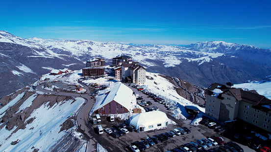 Panoramic view of Ski station centre resort at snowy Andes Mountains near Santiago Chile. Snow mountain landscape. Nevada mountains. Winter travel destination. Winter tourism travel.