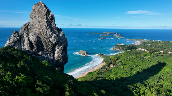 Seascape volcano mountains and beach at archipelago of Fernando de Noronha Brazil. Tropical volcano islands at Fernando de Noronha archipelago. Vacation travel. Tropical destination.