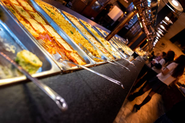 Trays with pasta dishes for self-service buffet in a restaurant.