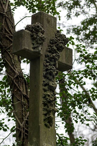 Bleak Headstone in an overrun Graveyard stock photo