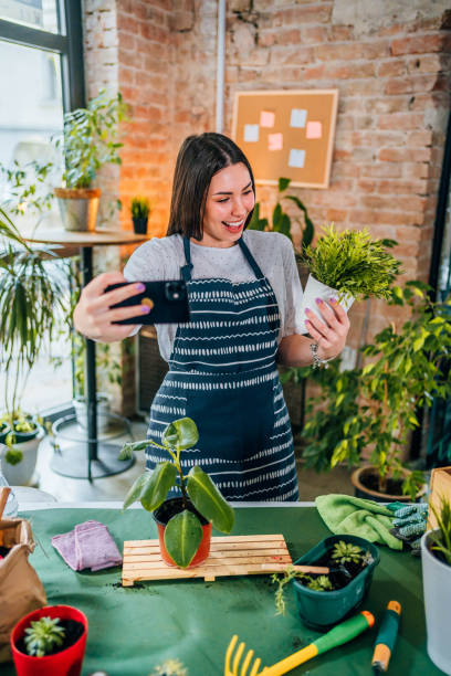 istock Woman taking a selfie with repotted plant 1706259958