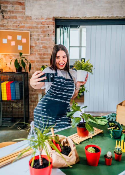 istock Woman taking a selfie with repotted plant 1706262310