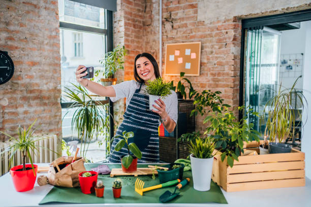 istock Woman taking a selfie with repotted plant 1706264558