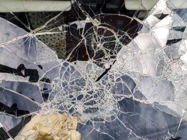 istock Car windshield shattered with stones by vandals. 1706266759