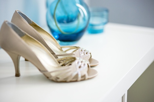 Wedding shoes on their wedding isolated in a room