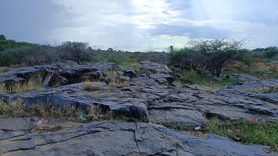 The uniqueness of this heritage site is that all the varieties of granite outcrops are present here in the form of hills, hillocks, boulders, sheet rocks. Apart from these physical attributes, the structural and weathering features are also exhibited in form of joints, cracks, potholes. The effects of wind and water erosion have converted part of granite into animal-like forms like Owl rock, Lion rock etc.\nIt is located in Pali district lying in the central part of Rajasthan state, but very near to Ajmer district boundary, the nearest town is Beawar which is 15kms away. This area is approachable round the year.