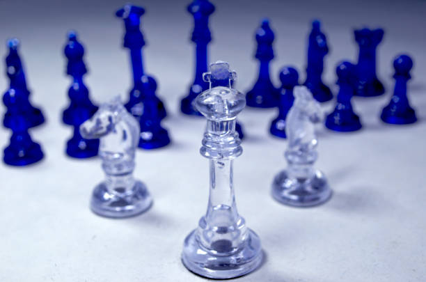 istock Chess pieces on a white background. Blue and white chess 1706305401