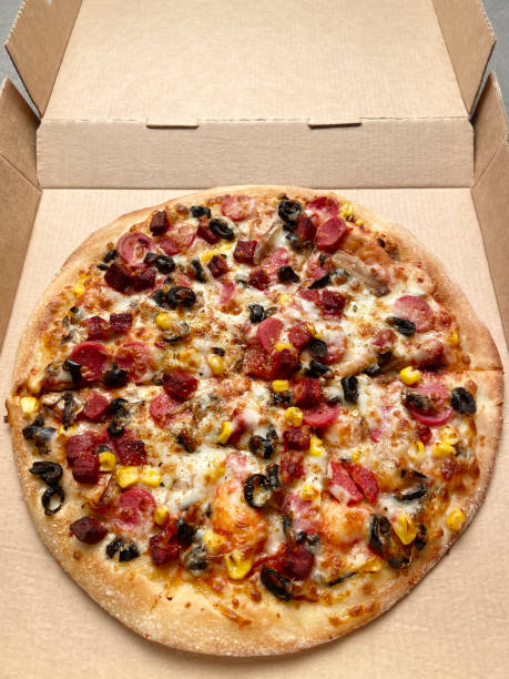 istock Pizza, mixed whole pizza in a pizza box 1706305943