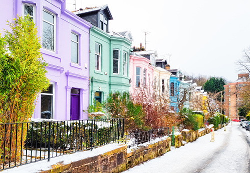 Victorian houses in Glasgow's Southside painted in contrasting colours. Photographed on a snowy winter's day.