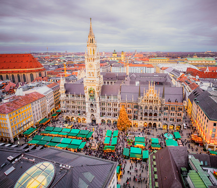 A view over Munich's Marienplatz in December, with Christmas Markets and decorations in the famous square at the centre of the city.