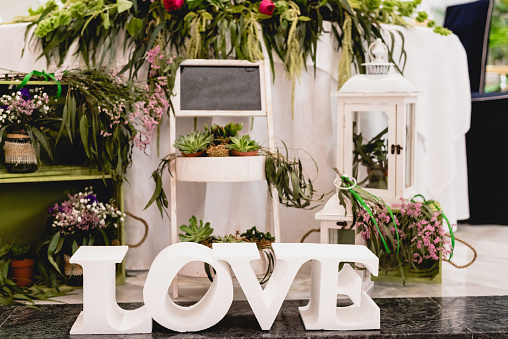 Word Love in wooden letters to decorate a wedding.