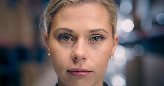 Serious, closeup and portrait of a woman in the workplace for business, corporate or working. Face, job and headshot or face of a female employee or worker in a professional building for career