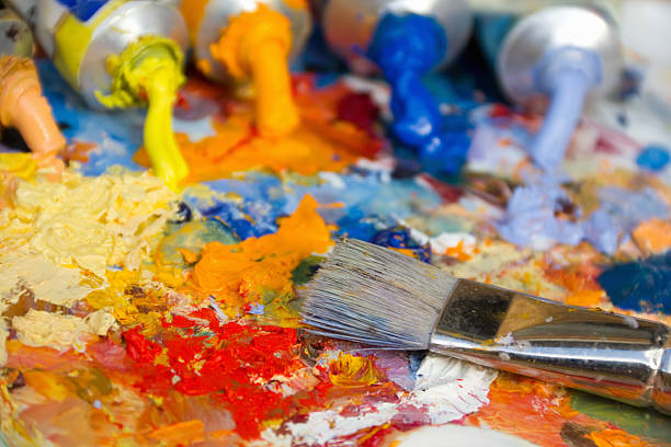 istock mixing oil paints with a brush 170633658