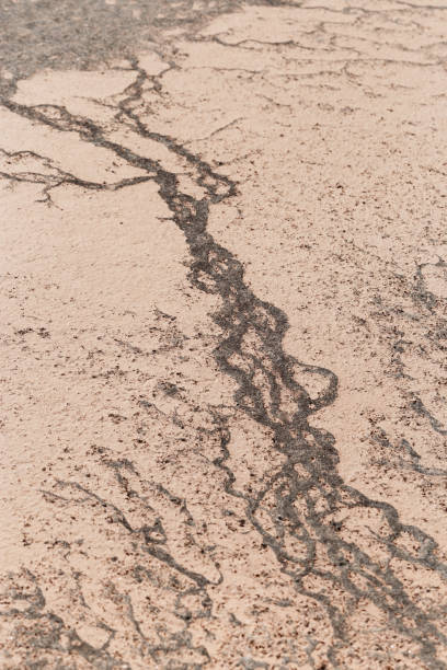 istock Abstract relief rough gritty neutral beige surface of background texture. Aesthetic pattern on sandstone. Top view textured sand, natural ornament or wallpaper, macro photo shore salt lake 1706343591