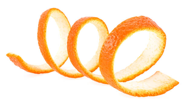 istock Single orange skin isolated on a white background. Curly fresh orange zest. 1706351794