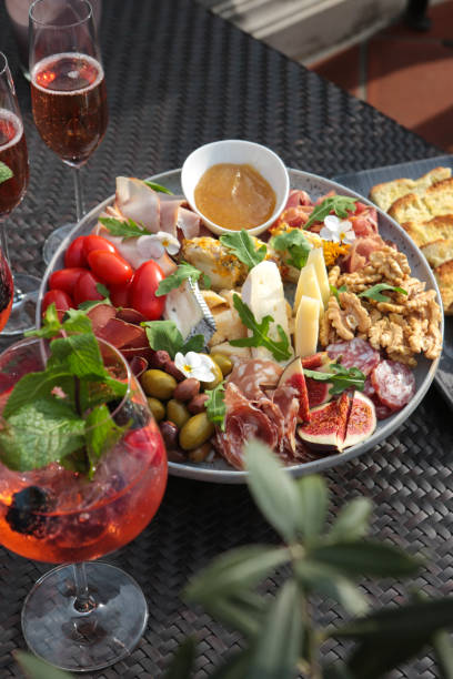 istock table with food and drinks appetizer antipasti plate for hosting guests at mediterranean Garden Party 1706366169