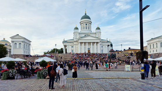 Helsinki , Finland - 8/24/2023: Crowds of people on the steps on the Cathedral
