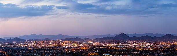 Phoenix and Scottsdale dusk panorama A panorama of Phoenix and Scottsdale Arizona at dusk. scottsdale arizona stock pictures, royalty-free photos & images