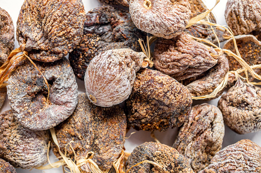 Top view of delicious dried figs isolated on white, panoramic shot. dried figs background.
