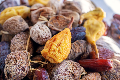 Top view of delicious dried figs, pears and dates, panoramic shot. dried fig background.