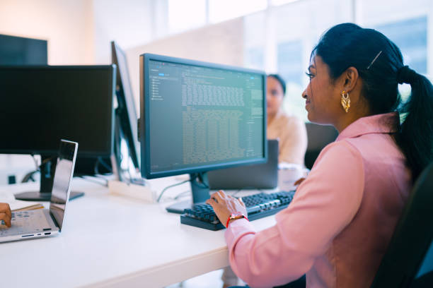 istock Happy Indian Female Programmer Working In Office. 1706380053
