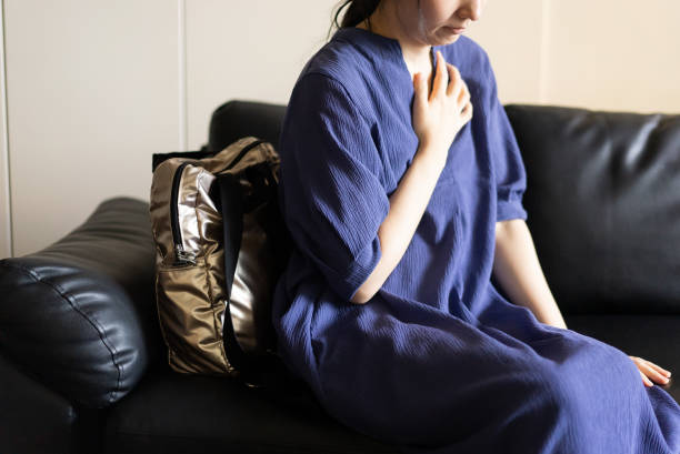 istock A woman with chest pains 1706386984