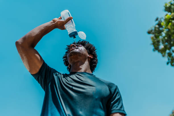 istock Young man pouring water on the forehead during sports activity 1706399213