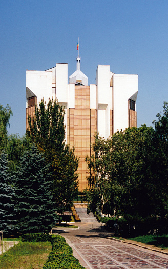 Chișinău, Moldova: headquarters of the Office of the President of the Republic of Moldova  - Presidential Palace, completed in 1987, was one of the last major Soviet buildings built in the Moldavian Soviet Socialist Republic, originally to house the house the Supreme Council of the Moldavian SSR - designed by Yuri Tumanyan, Arkady Zaltsman and Viktor Yavorsky in Soviet modernism style - Stefan cel Mare Boulevard.