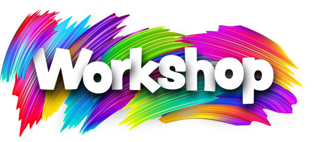 istock Workshop paper word sign with colorful spectrum paint brush strokes over white. 1706403630