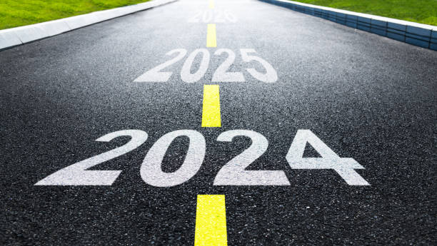 istock New year 2024, 2025 and 2026 on asphalt road 1706406676