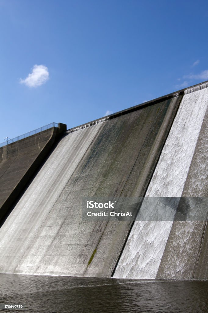 Llys y Fran Reservoir Dam overflow White water overspill run off on the stark sunlit concrete wall of Llys y Fran Reservoir Dam, Pembrokeshire, Wales, UK Abstract Stock Photo