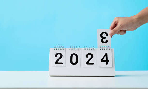 istock Hand holding calendar sheets 2023 change to 2024 1706408362