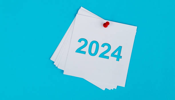 istock White sticky note with happy new year 2024 on blue background 1706409146