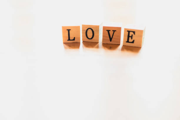 istock Word love on wooden dice and white background. 1706423345