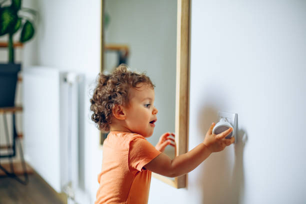 istock Baby touching electrical plug in the wall 1706448129